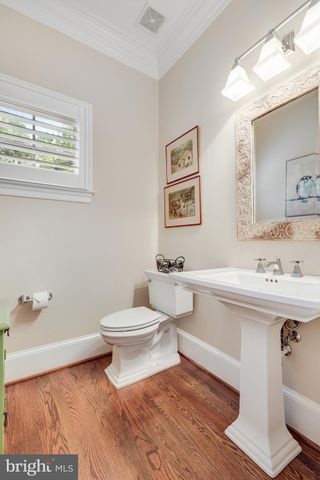 a bedroom with a flat screen tv on dresser and a flat screen tv