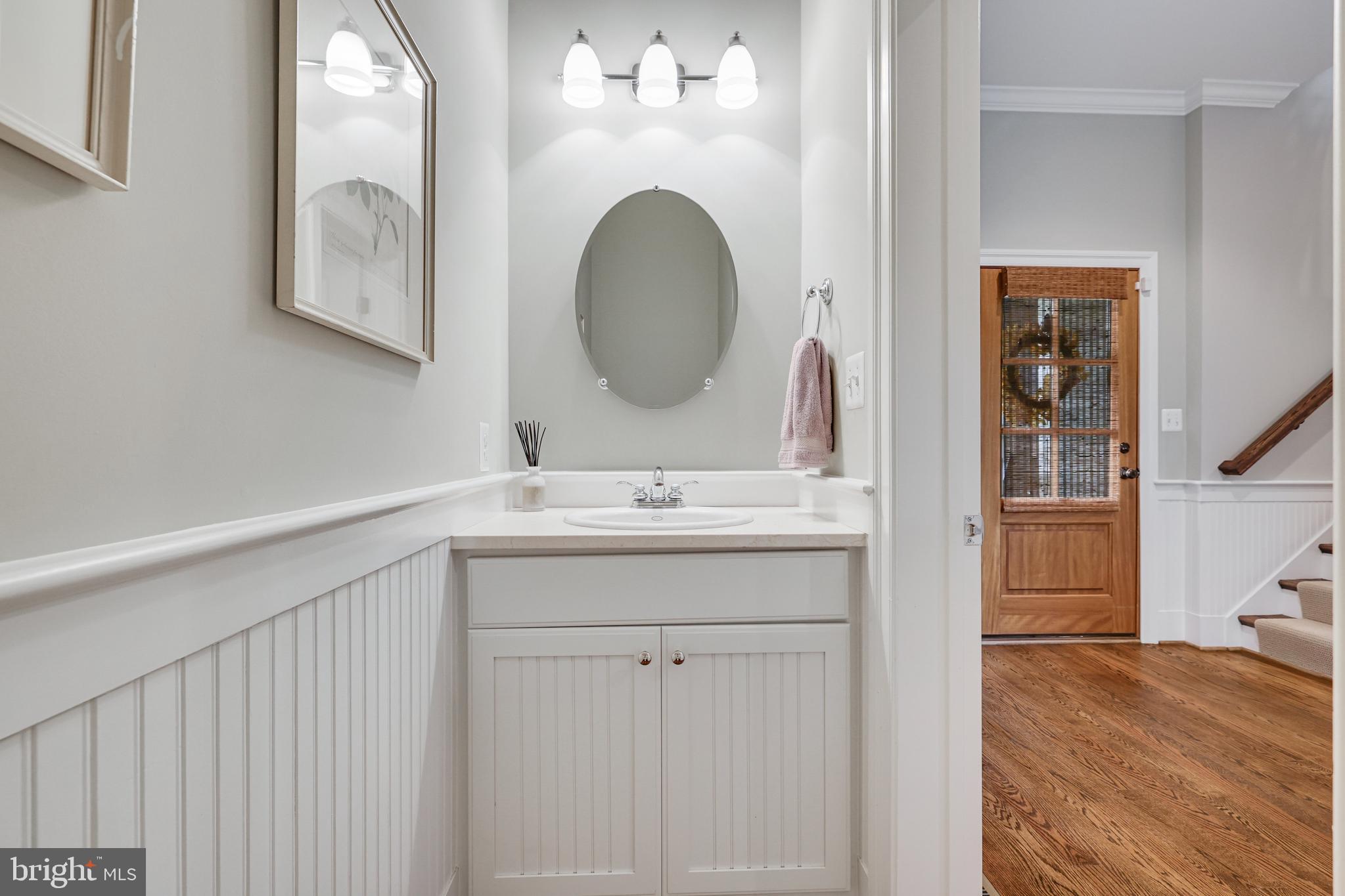 1415 Kurtz Road McLean, VA 22101 - Photo 41 of 129 a bathroom with a double vanity sink and a mirror