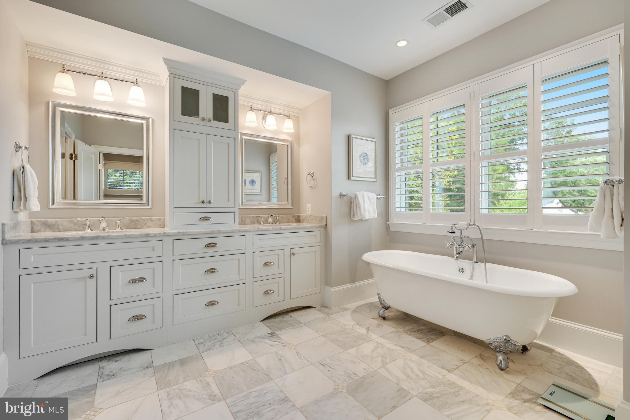 1415 Kurtz Road McLean, VA 22101 - Photo 53 of 129 a spacious bathroom with a double vanity sink a mirror and a bathtub