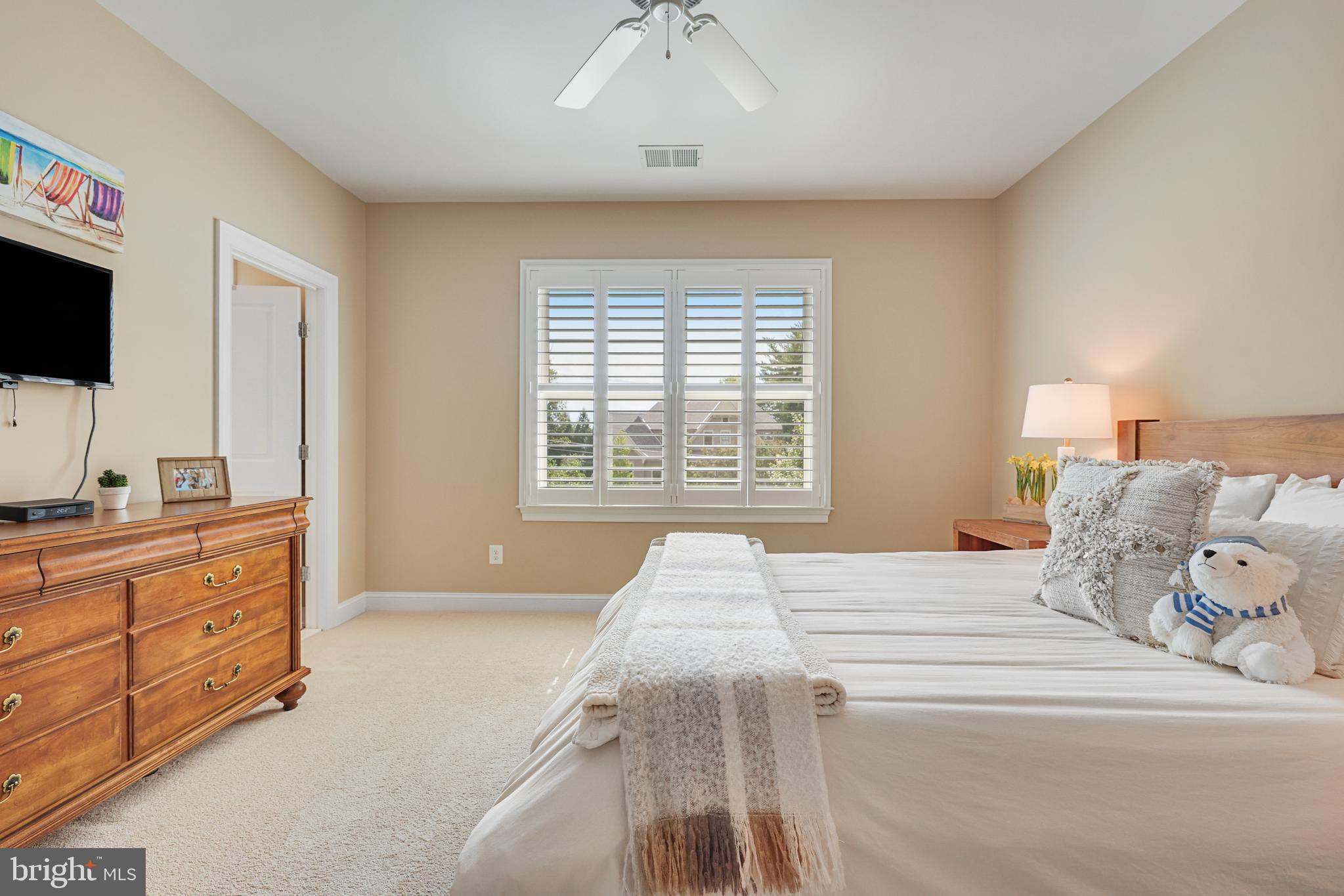 1415 Kurtz Road McLean, VA 22101 - Photo 59 of 129 a spacious bedroom with a bed and a flat screen tv