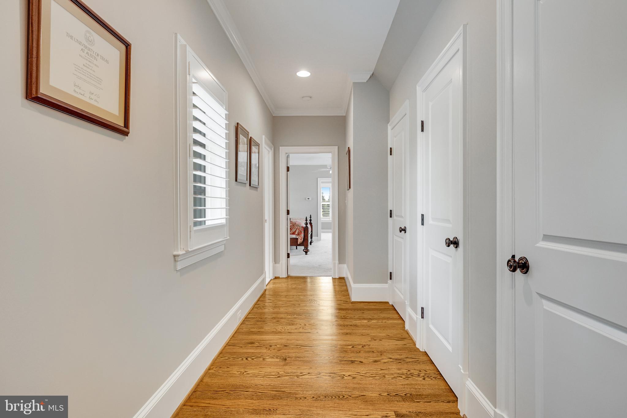 1415 Kurtz Road McLean, VA 22101 - Photo 65 of 129 a view of a hallway with wooden floor and a bathroom