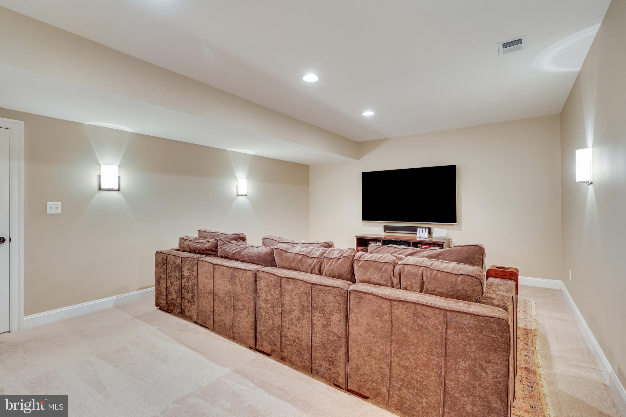 1415 Kurtz Road McLean, VA 22101 - Photo 81 of 129 a living room with furniture and a flat screen tv