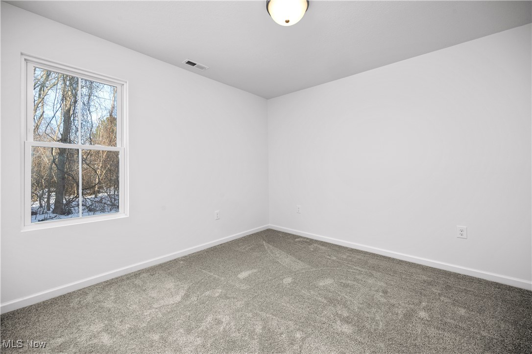 1999 East Oldgate Road Sandusky, OH 44870 - Photo 30 of 32 Empty room featuring baseboards and carpet floors