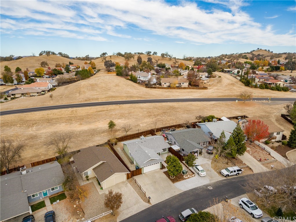 4913 Sparrow Hawk Lane Paso Robles, CA 93446 - Photo 13 of 37 The home backs to a large greenbelt and has hillside views beyond.
