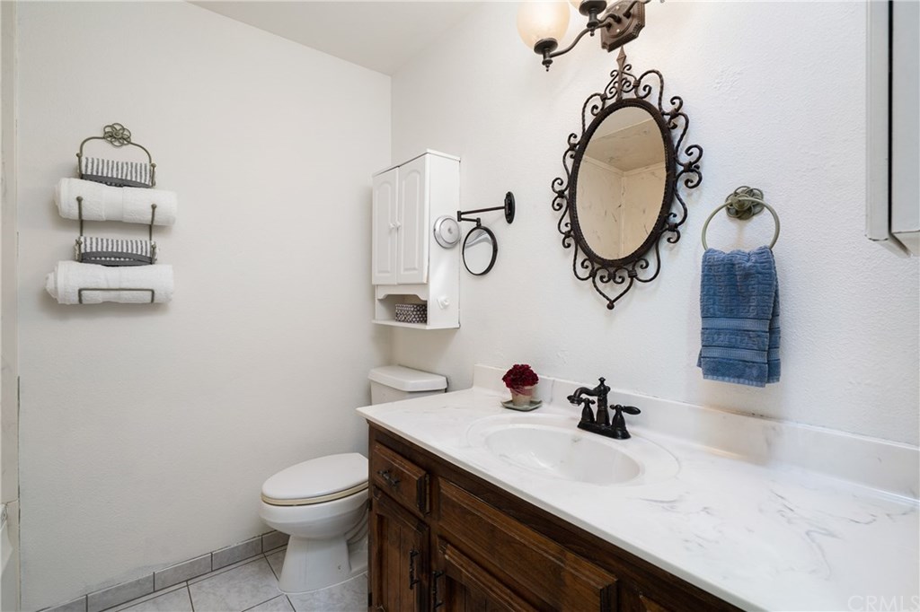 4913 Sparrow Hawk Lane Paso Robles, CA 93446 - Photo 18 of 37 The hall bath has tile floors, jetted tub and nice vanity.