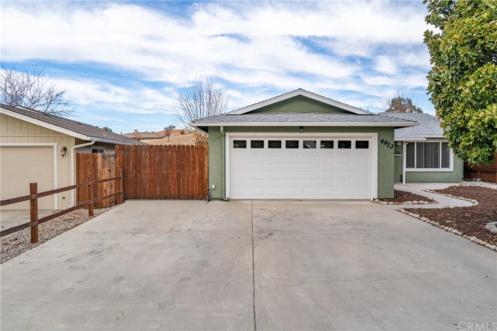 4913 Sparrow Hawk Lane Paso Robles, CA 93446 - Photo 3 of 37 Check out the 2 car garage and gated RV parking for all your lake toys. Lots of flat work for additional parking.