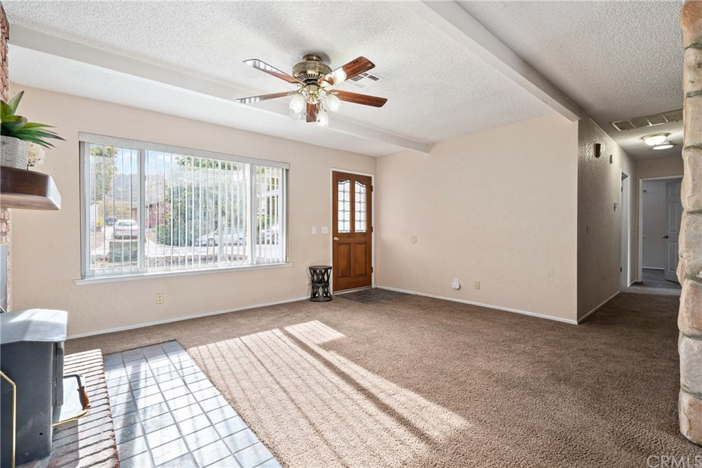 4913 Sparrow Hawk Lane Paso Robles, CA 93446 - Photo 25 of 37 Nice living room with natural light and ceiling fan.