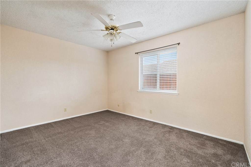 4913 Sparrow Hawk Lane Paso Robles, CA 93446 - Photo 28 of 37 Bedroom 2 with ceiling fan and wardrobe closet