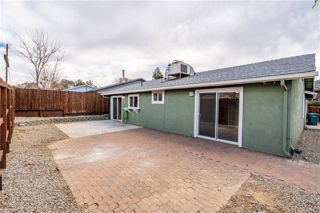 4913 Sparrow Hawk Lane Paso Robles, CA 93446 - Photo 33 of 37 Back view shows the slider from the master bedroom to the patio area.