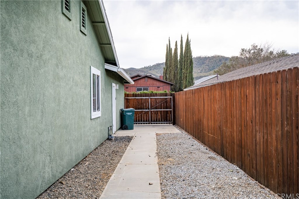 4913 Sparrow Hawk Lane Paso Robles, CA 93446 - Photo 37 of 37 Side of house shows RV area with gate and new fencing.