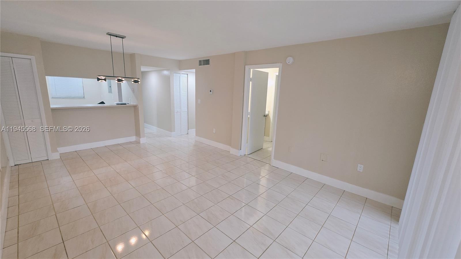 19791 Southwest 114th Avenue, Unit 131 Miami, FL 33157 - Photo 2 of 12 a view of kitchen with refrigerator and window