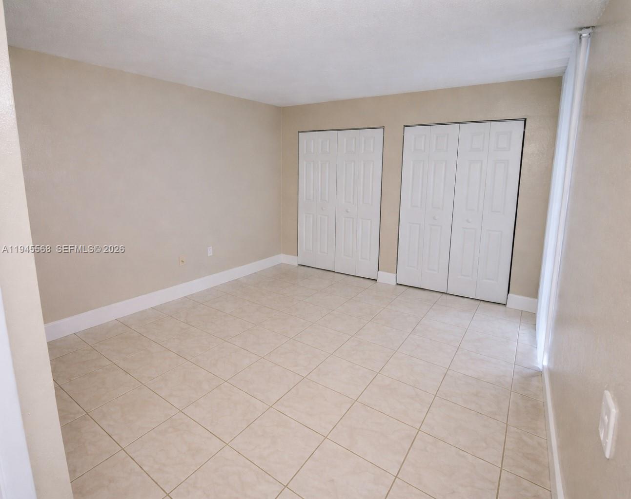 19791 Southwest 114th Avenue, Unit 131 Miami, FL 33157 - Photo 6 of 12 a view of an empty room and entryway