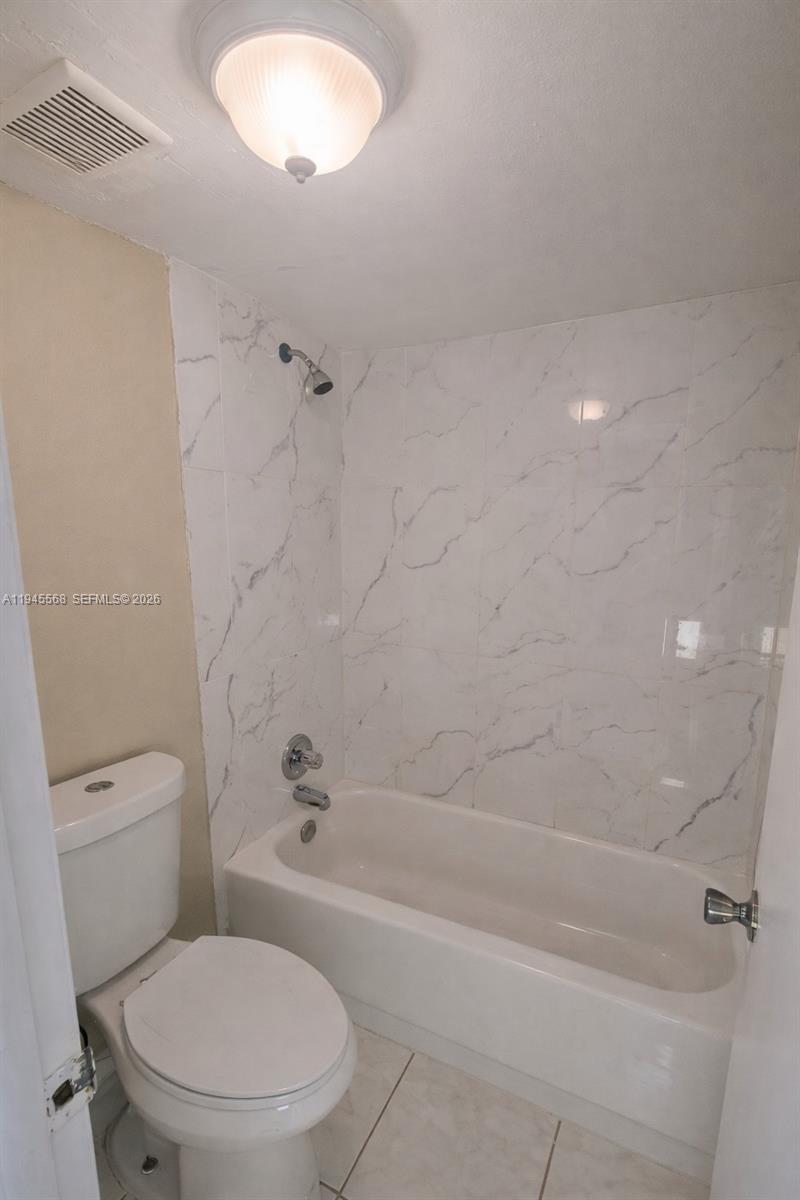 19791 Southwest 114th Avenue, Unit 131 Miami, FL 33157 - Photo 8 of 12 a bathroom with a toilet and a shower