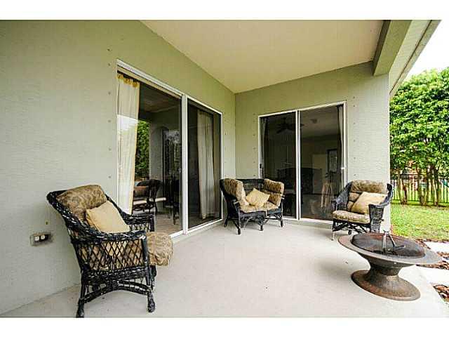2183 Southwest Panther Trace Stuart, FL 34997 - Photo 24 of 25 a outdoor space with patio the couch and chairs