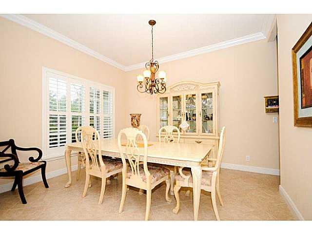 2183 Southwest Panther Trace Stuart, FL 34997 - Photo 4 of 25 a view of a dining room with furniture and window