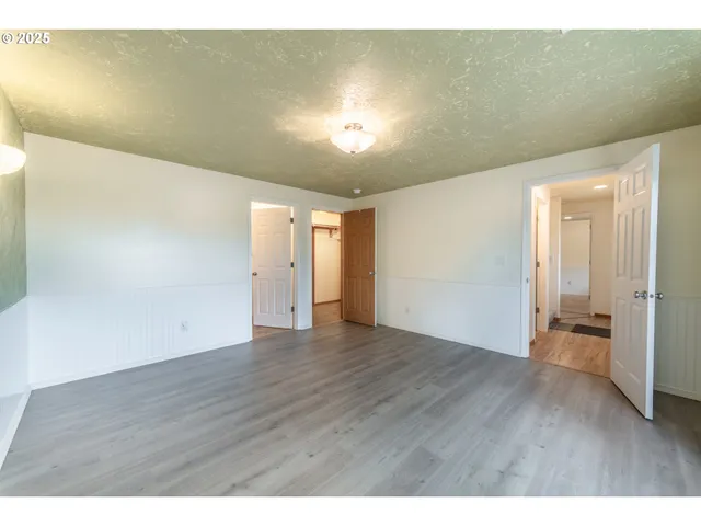 a bathroom with a toilet a sink and a mirror
