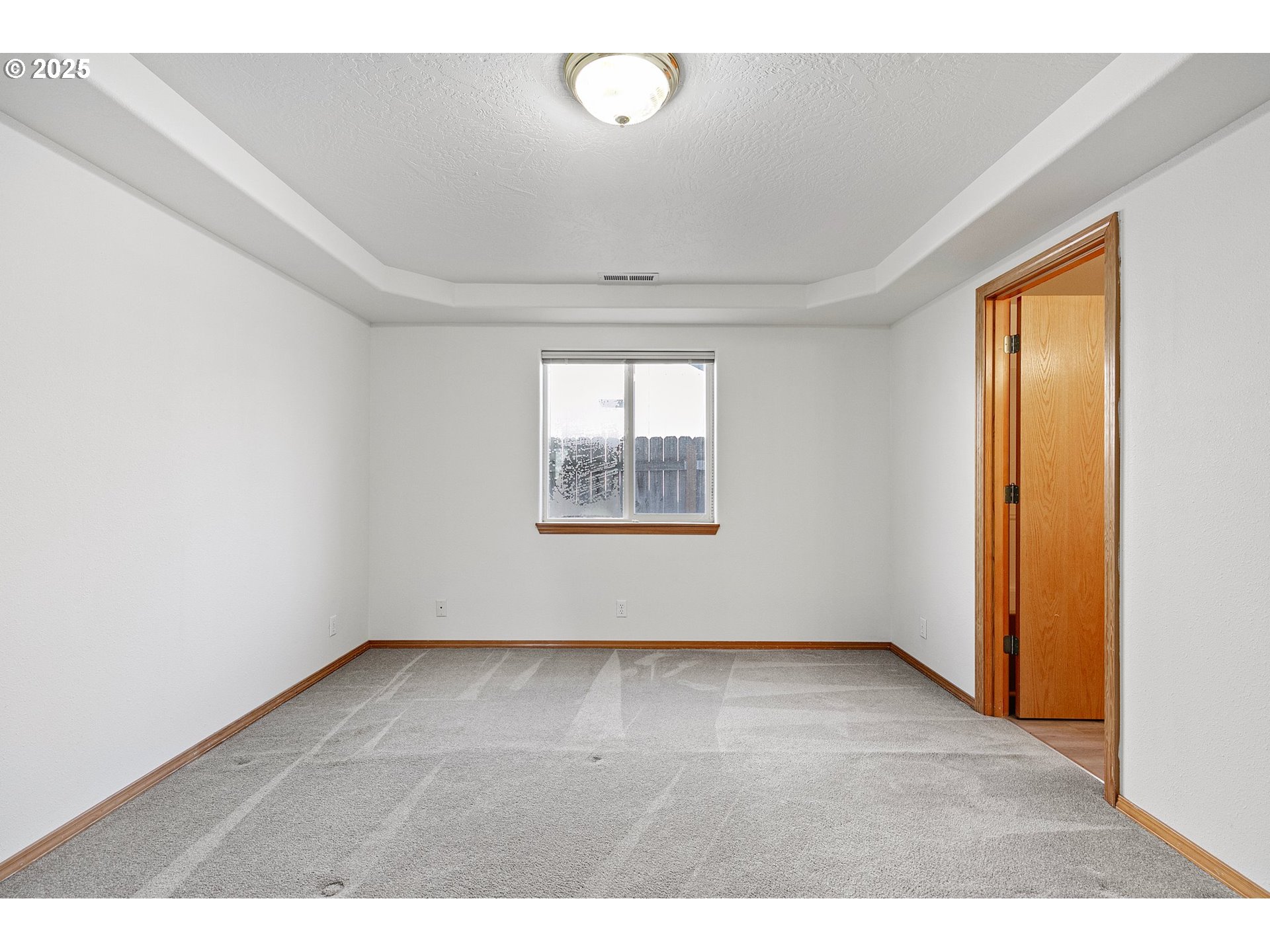 4018 Forsythia Street Springfield, OR 97478 - Photo 20 of 39 a view of an empty room with a window