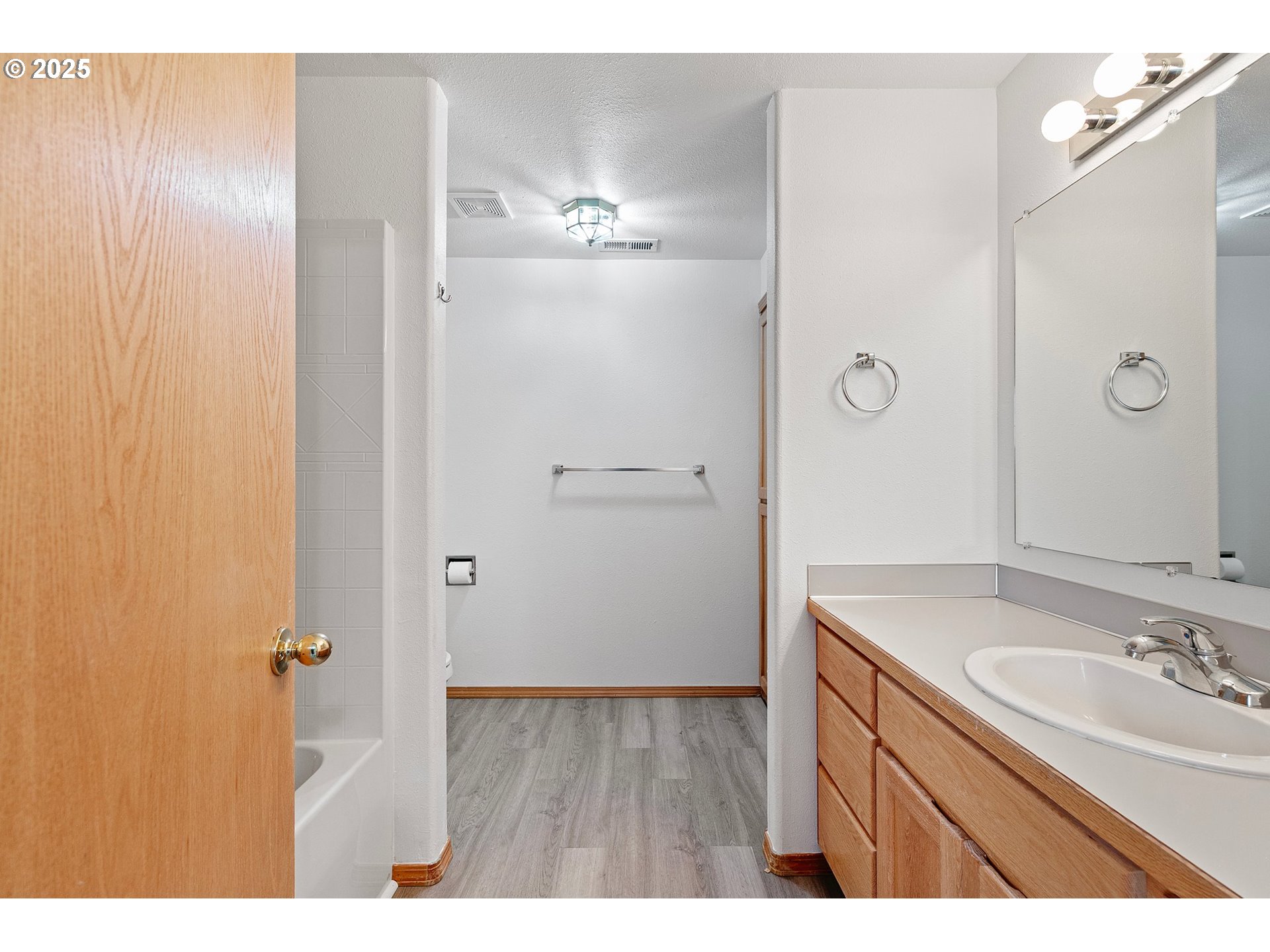 4018 Forsythia Street Springfield, OR 97478 - Photo 23 of 39 a bathroom with a granite countertop sink two mirror and shower