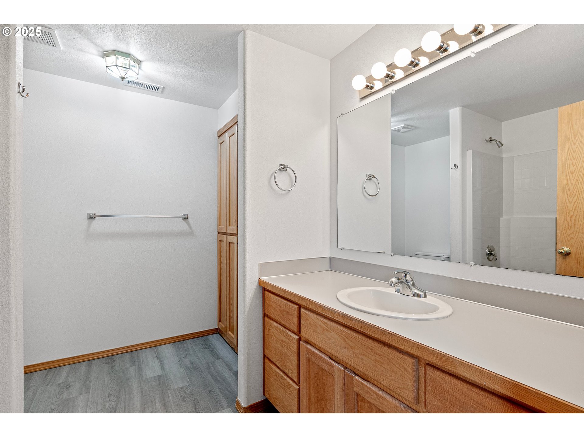 4018 Forsythia Street Springfield, OR 97478 - Photo 24 of 39 a bathroom with a sink vanity granite and a mirror