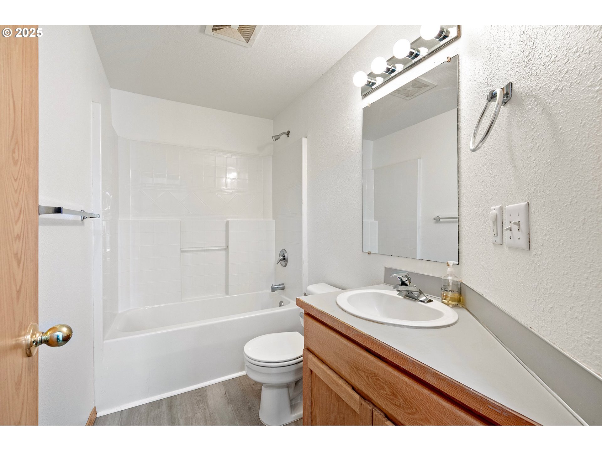 4018 Forsythia Street Springfield, OR 97478 - Photo 26 of 39 a bathroom with a sink a toilet a shower and a mirror