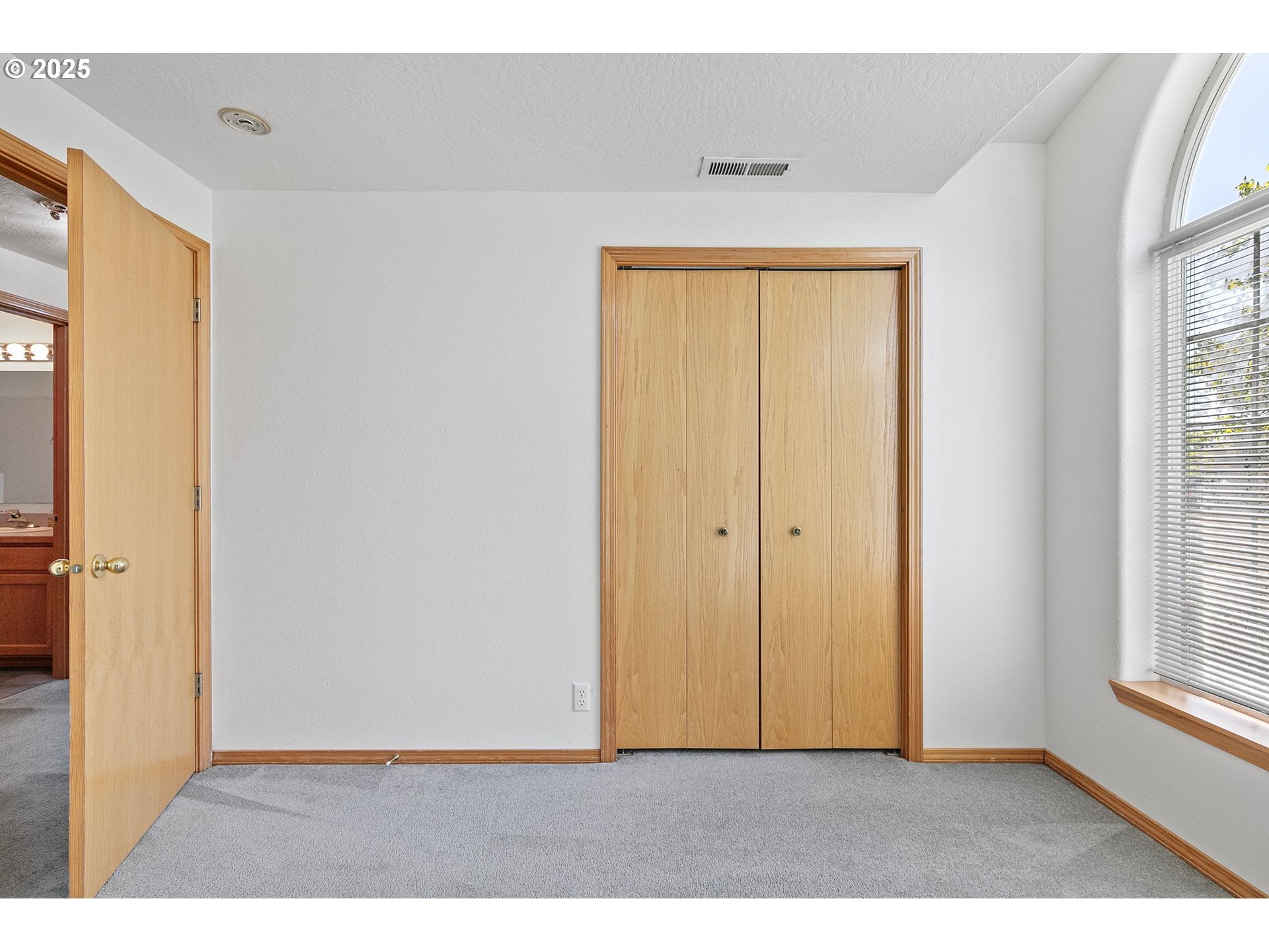 4018 Forsythia Street Springfield, OR 97478 - Photo 30 of 39 a view of an empty room with wooden floor and a window