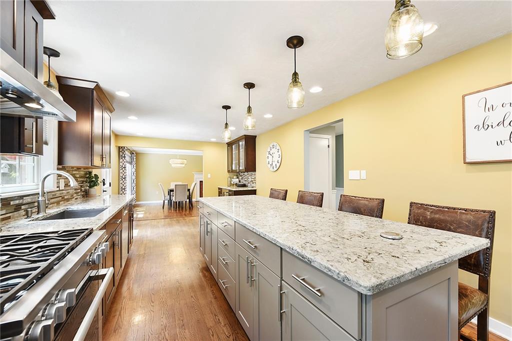 719 Pinetree Road Pittsburgh, PA 15243 - Photo 12 of 35 a large kitchen with granite countertop a lot of counter space