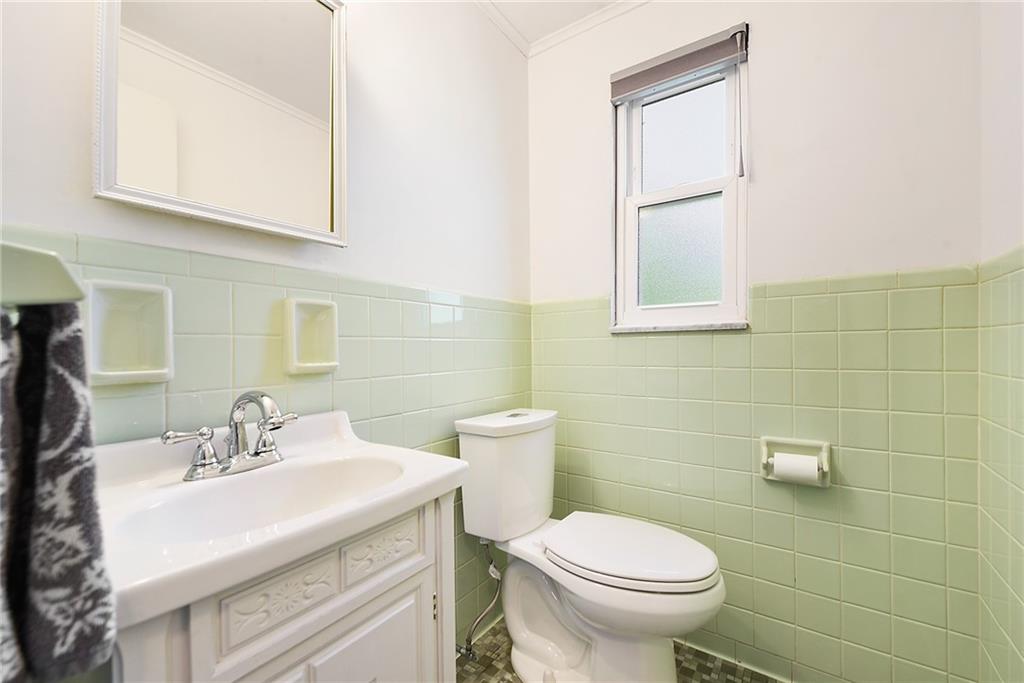 719 Pinetree Road Pittsburgh, PA 15243 - Photo 16 of 35 a bathroom with a sink toilet and a mirror