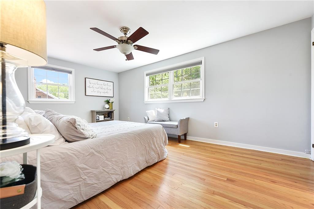 719 Pinetree Road Pittsburgh, PA 15243 - Photo 18 of 35 a bedroom with a bed and wooden floor