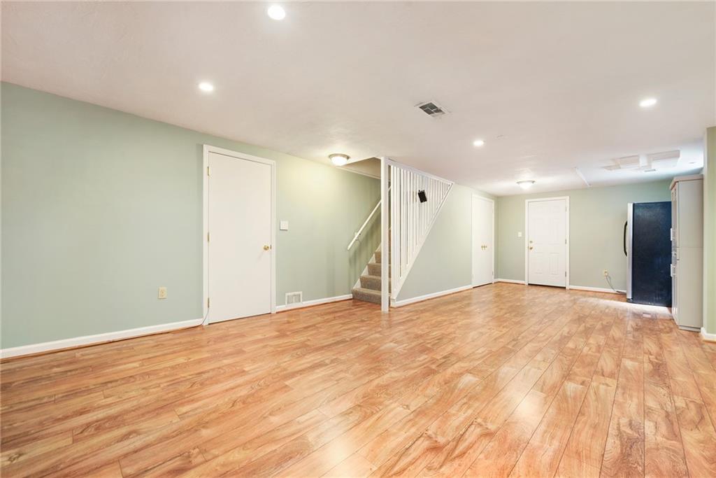 719 Pinetree Road Pittsburgh, PA 15243 - Photo 26 of 35 a view of an empty room with wooden floor