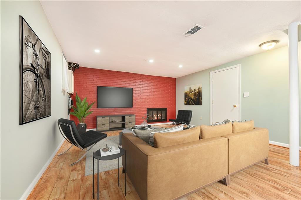 719 Pinetree Road Pittsburgh, PA 15243 - Photo 27 of 35 a living room with furniture and a flat screen tv