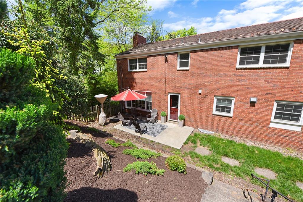 719 Pinetree Road Pittsburgh, PA 15243 - Photo 34 of 35 a view of backyard with a patio and outdoor seating
