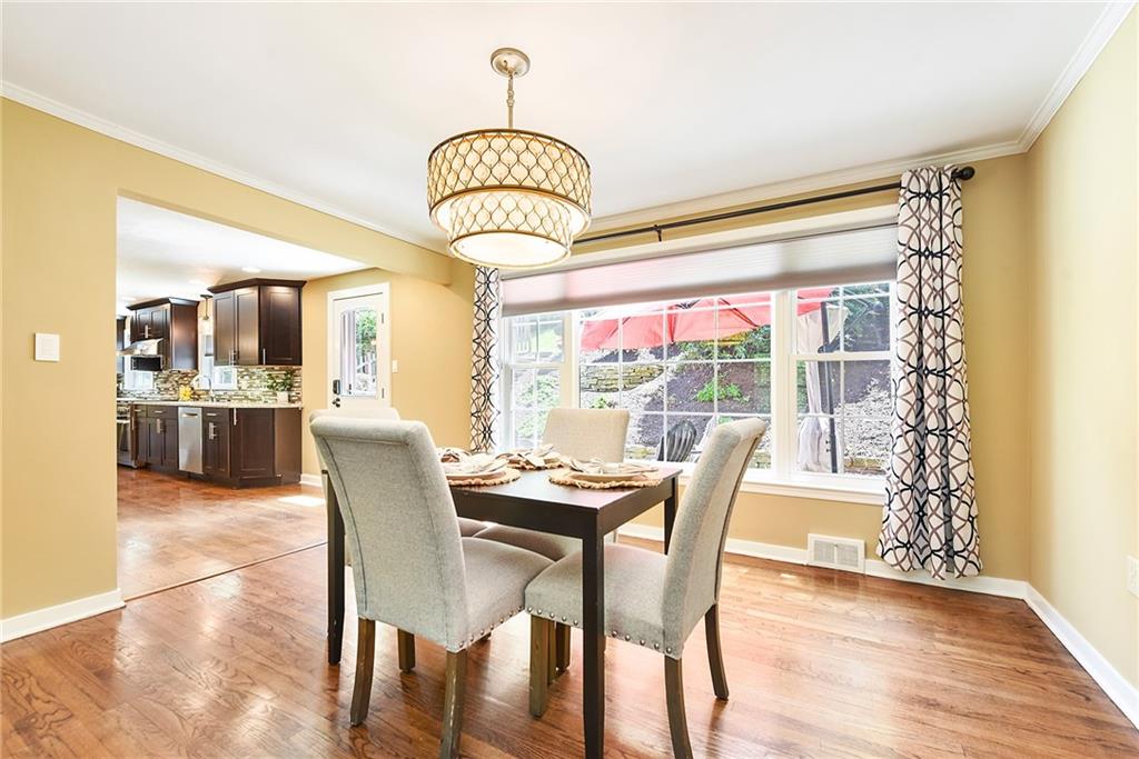 719 Pinetree Road Pittsburgh, PA 15243 - Photo 5 of 35 a view of a dining room with furniture window and wooden floor
