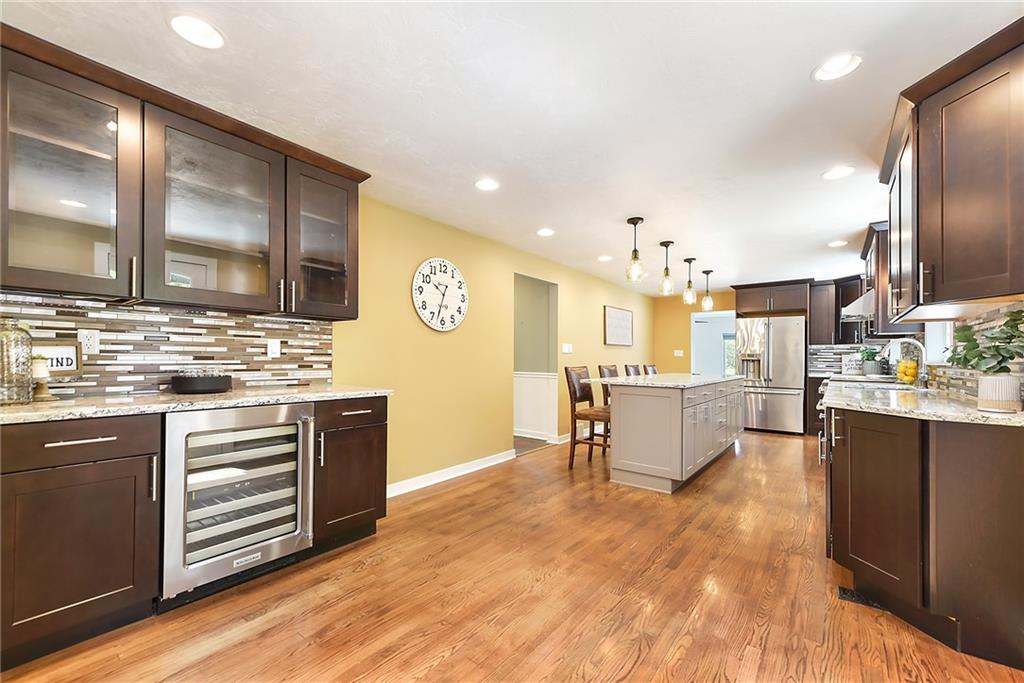 719 Pinetree Road Pittsburgh, PA 15243 - Photo 7 of 35 a large kitchen with cabinets and stainless steel appliances