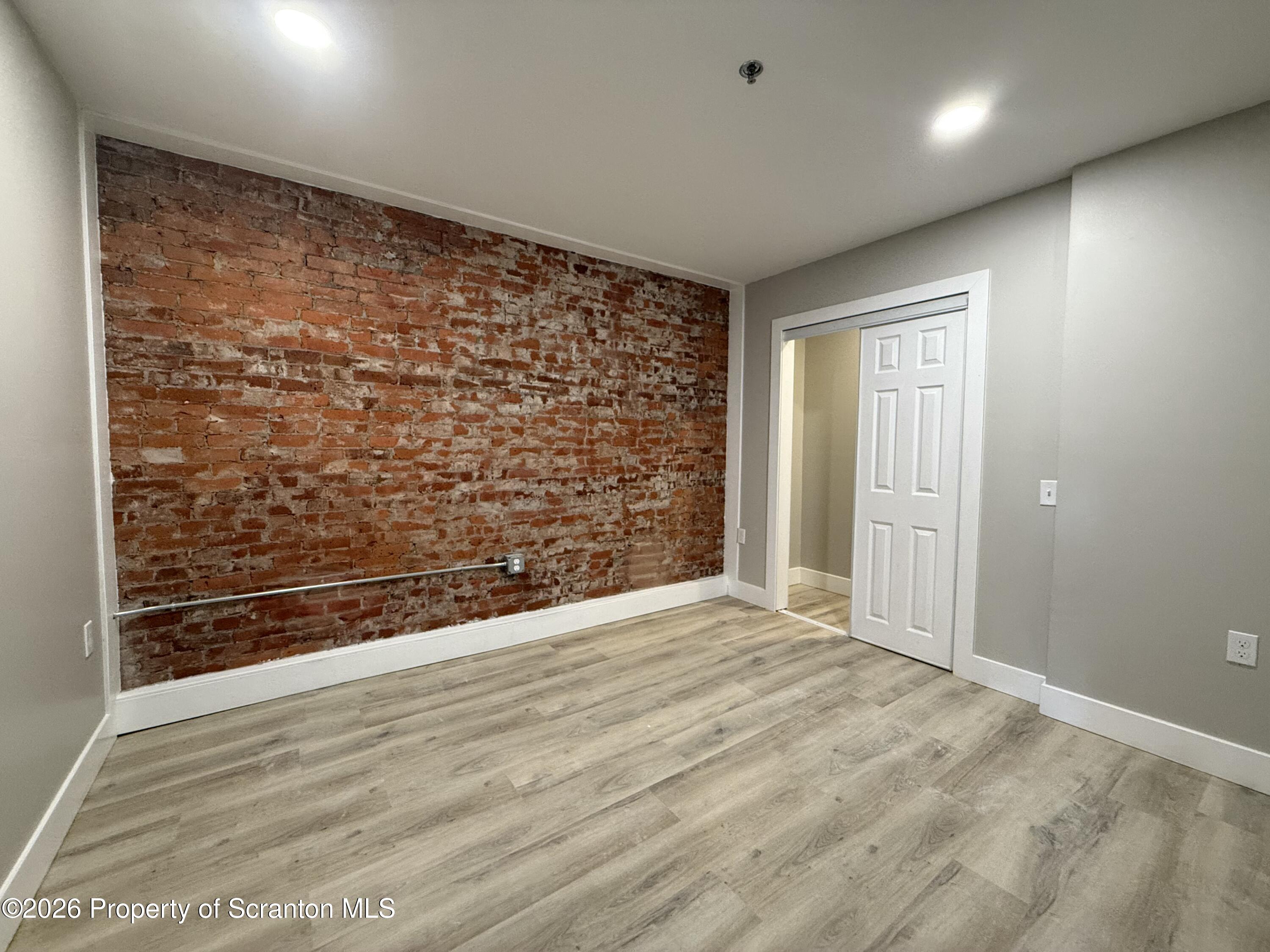 205 North Washington Avenue, Unit 9 Scranton, PA 18503 - Photo 4 of 6 a view of an empty room and wooden floor