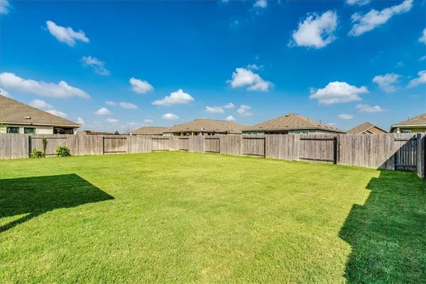 a view of a house with a big yard