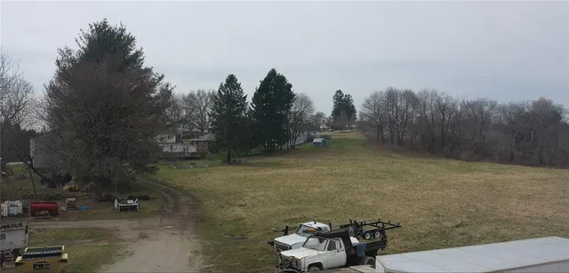 a view of a backyard of the house