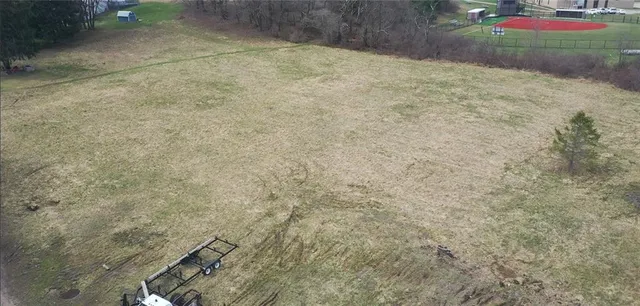 a view of a backyard of the house