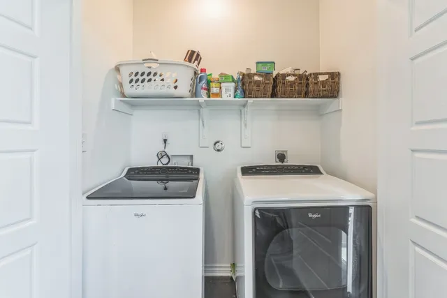 a bathroom with a bathtub shower sink vanity and toilet