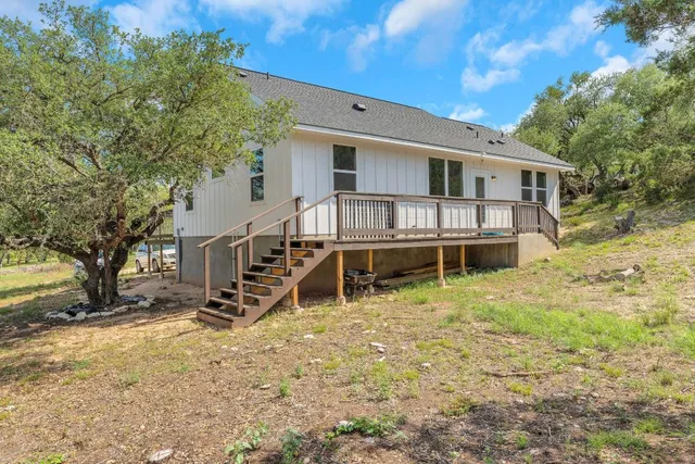 a view of a chairs and table in the patio