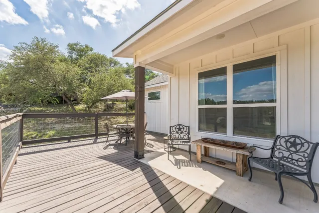 a balcony with furniture and a potted plant