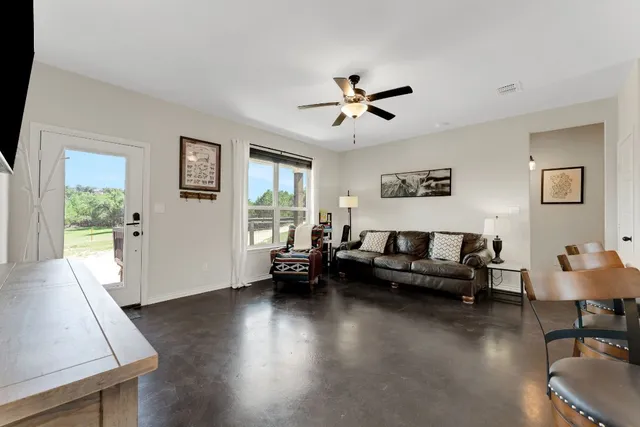 a living room with furniture and a window