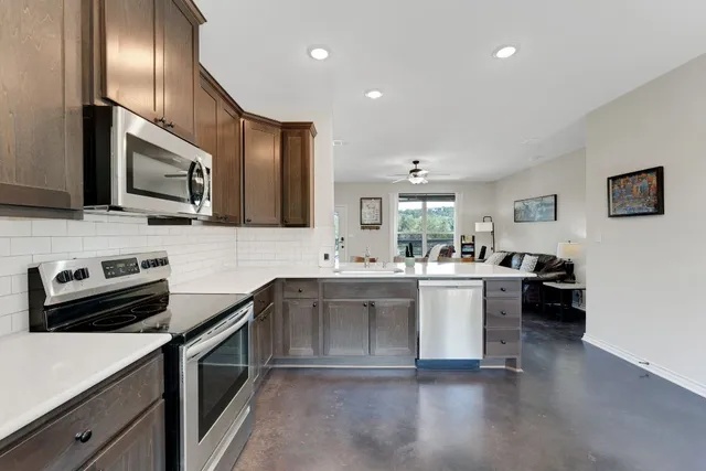 a view of a chairs on the roof deck