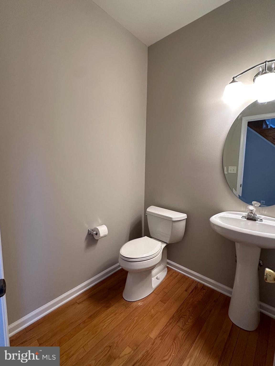 2143 Brackenville Road Hockessin, DE 19707 - Photo 12 of 26 a bathroom with a toilet a sink and mirror