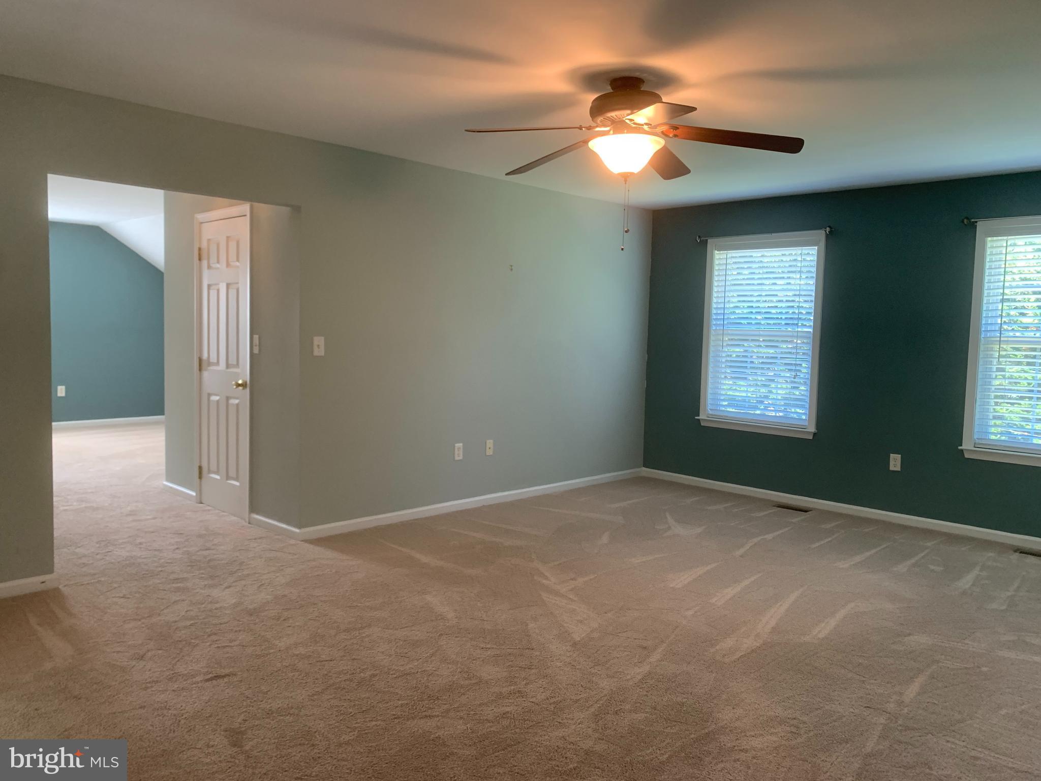 2143 Brackenville Road Hockessin, DE 19707 - Photo 13 of 26 a view of a room with a ceiling fan and a window