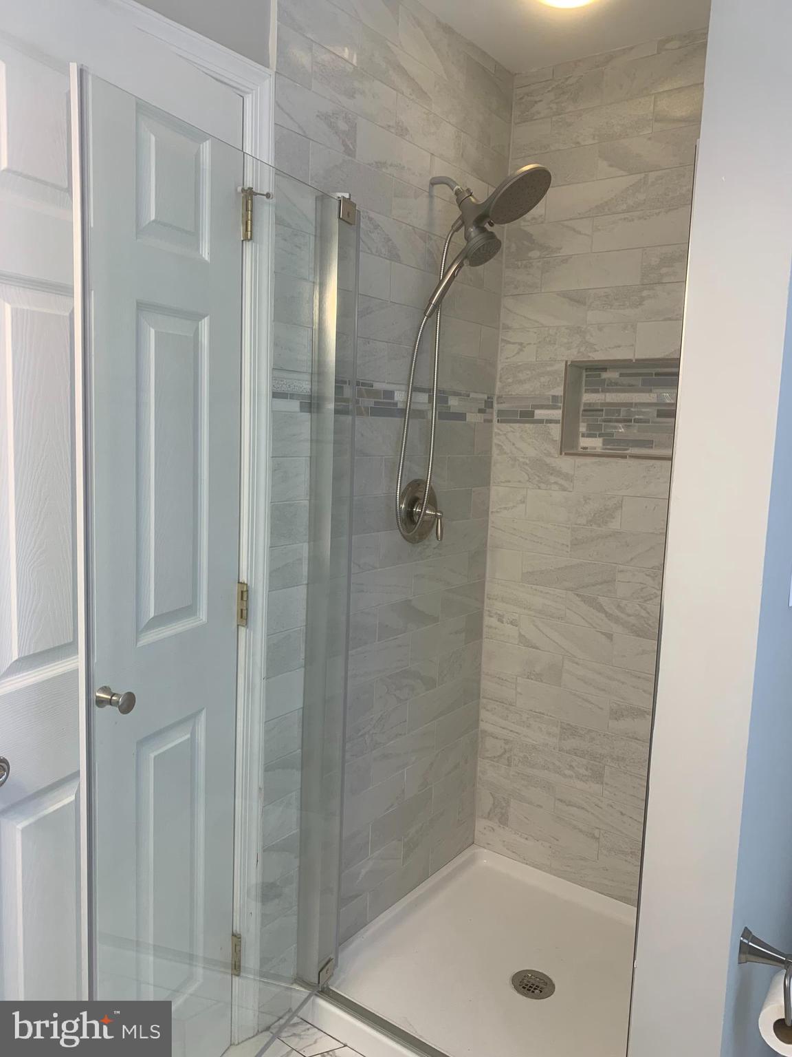 2143 Brackenville Road Hockessin, DE 19707 - Photo 17 of 26 a bathroom with a shower