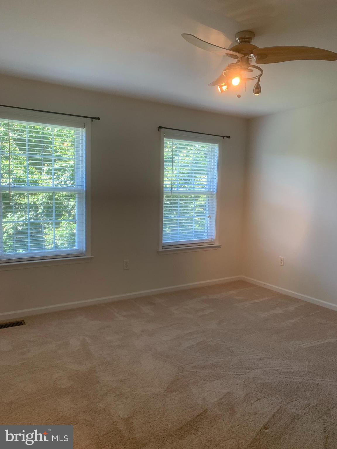 2143 Brackenville Road Hockessin, DE 19707 - Photo 18 of 26 an empty room with windows and fan