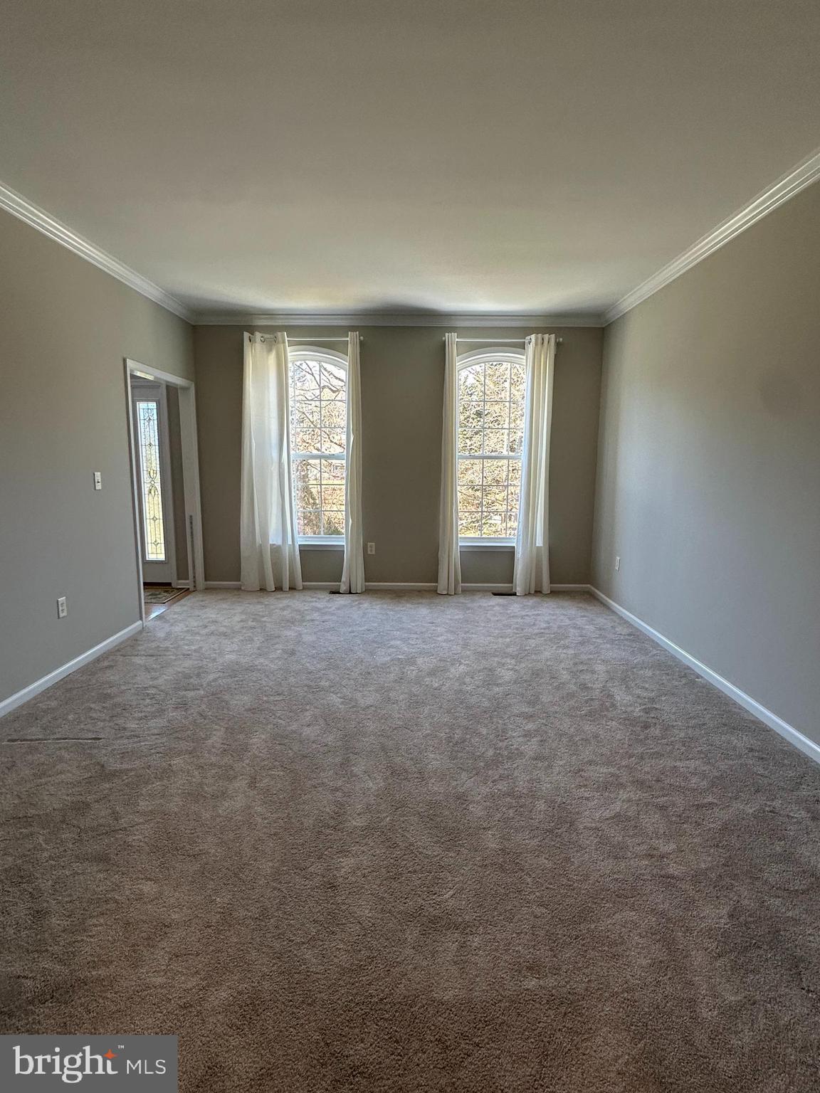 2143 Brackenville Road Hockessin, DE 19707 - Photo 4 of 26 a view of a big room with windows and chandelier fan
