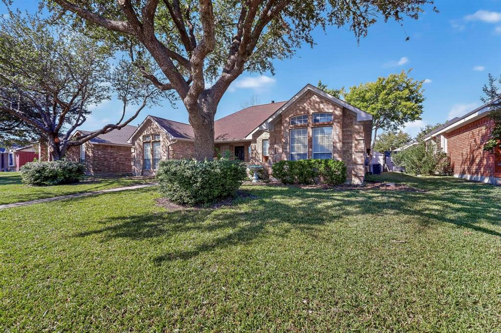 2601 Daisy Lane Rowlett, TX 75089 - Photo 1 of 36 a front view of a house with a yard