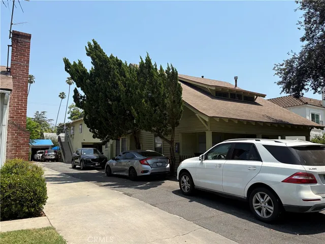 a view of a car parked in front of a house
