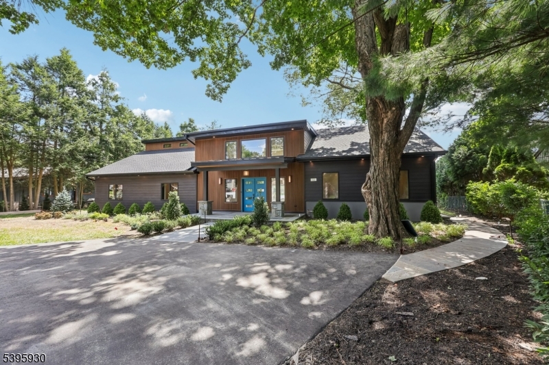 12 Rocky Point Road West Milford, NJ 07421 - Photo 2 of 50 a front view of a house with a yard and a tree